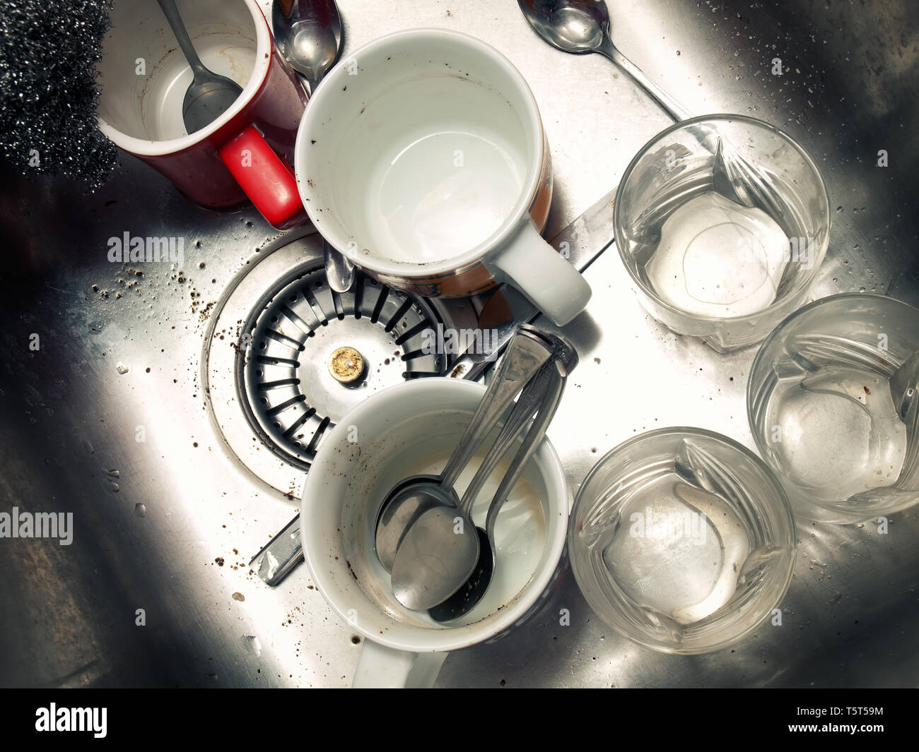 A lot of dirty dishes in the kitchen sink. Stock Photo