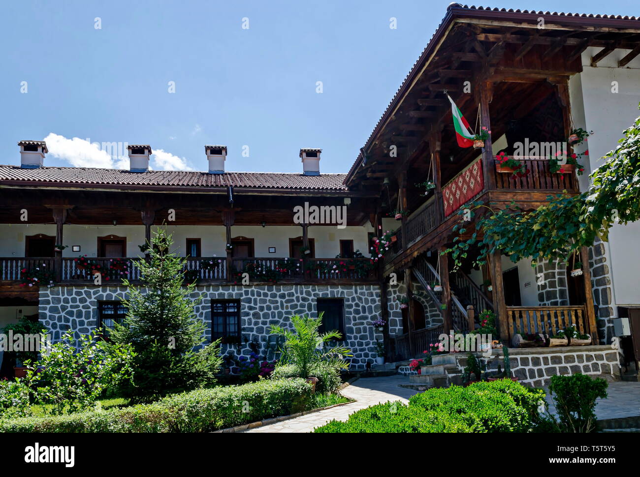 Part of exterior ancient monastic house in Klisura Monastery St. Cyril and St. Methodius, founded in the 12th century, mountain Balkan, near Varshets Stock Photo