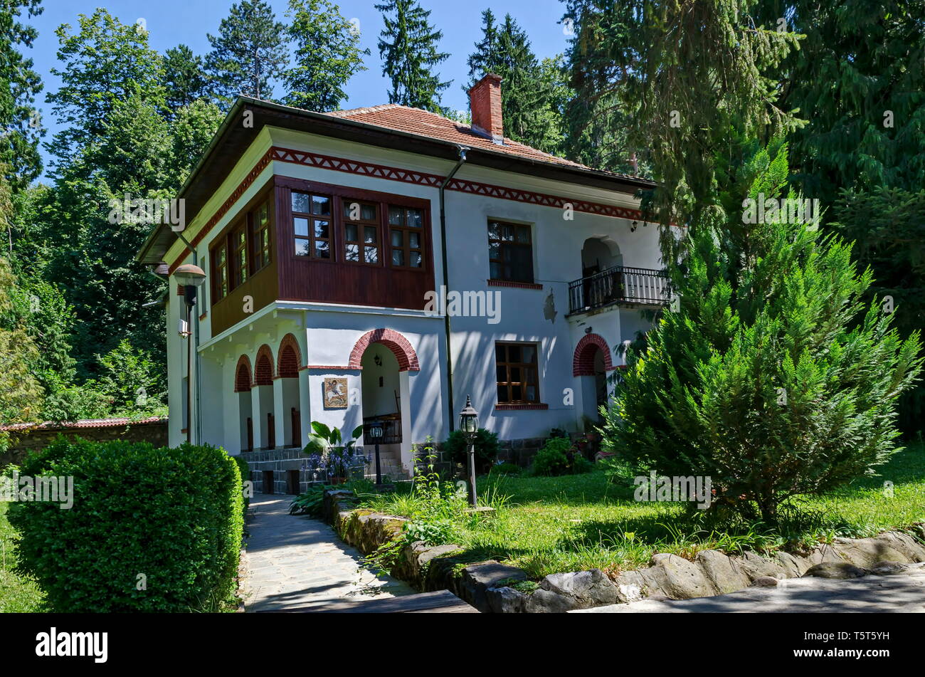 Part of exterior ancient monastic house in Klisura Monastery St. Cyril and St. Methodius, founded in the 12th century, mountain Balkan, near Varshets Stock Photo