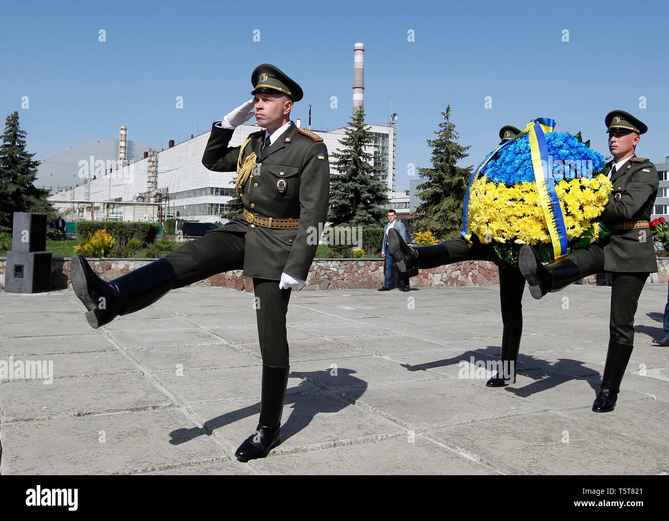Ukrainian soldiers are seen with flowers during the anniversary. Ukrainians marked the 33rd anniversary of Chernobyl catastrophe. The explosion of the fourth block of the Chernobyl nuclear plant on 26 April 1986 is still regarded as the biggest accident in the history of nuclear power generation. Stock Photo