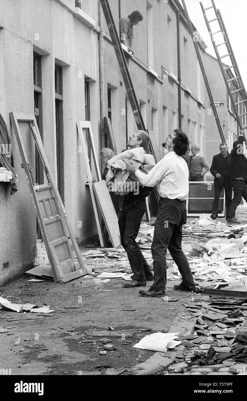 Clearing up after IRA bomb damage in the Shankill Loyalist area of