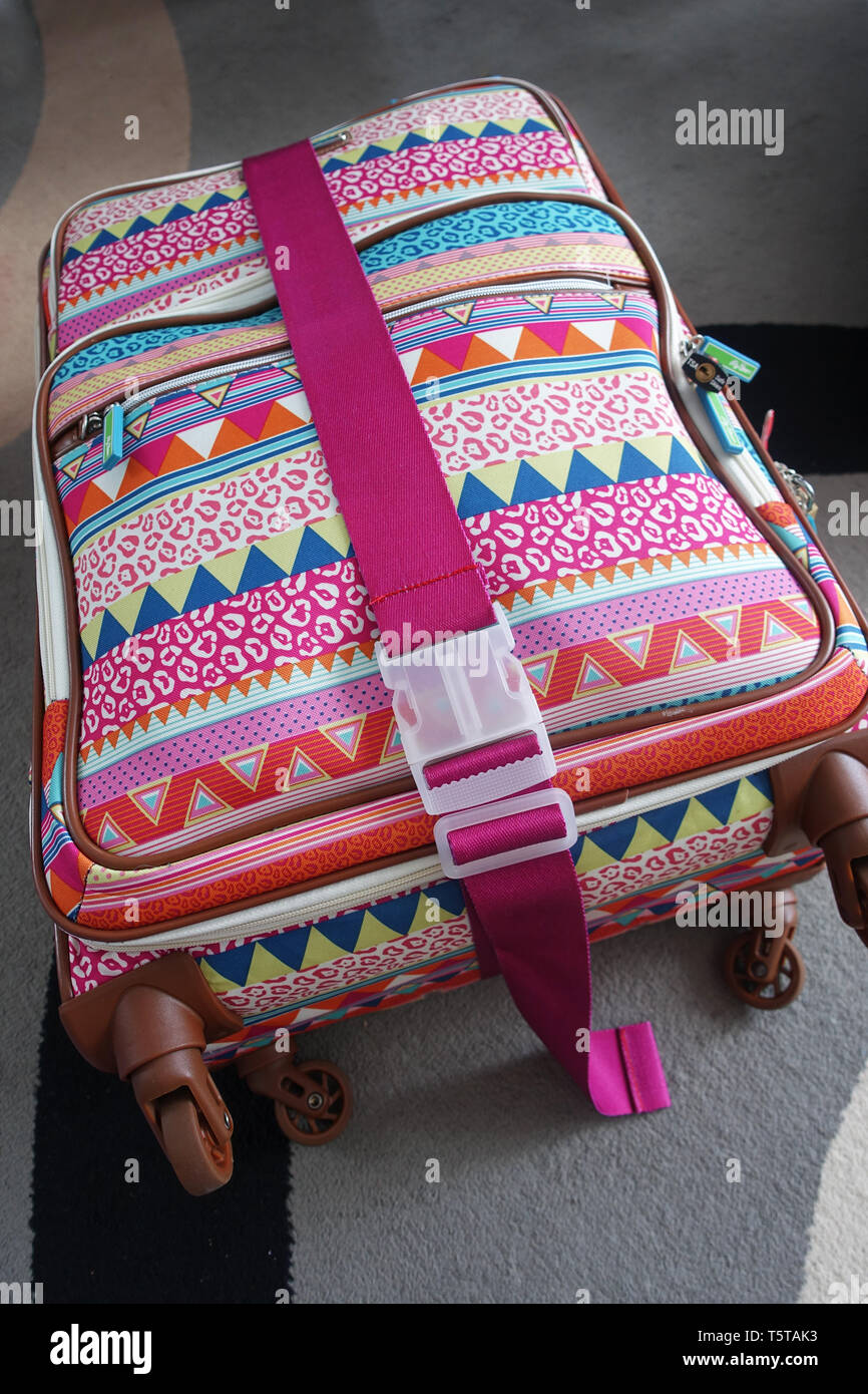 Pink Luggage strap on a luggage Stock Photo