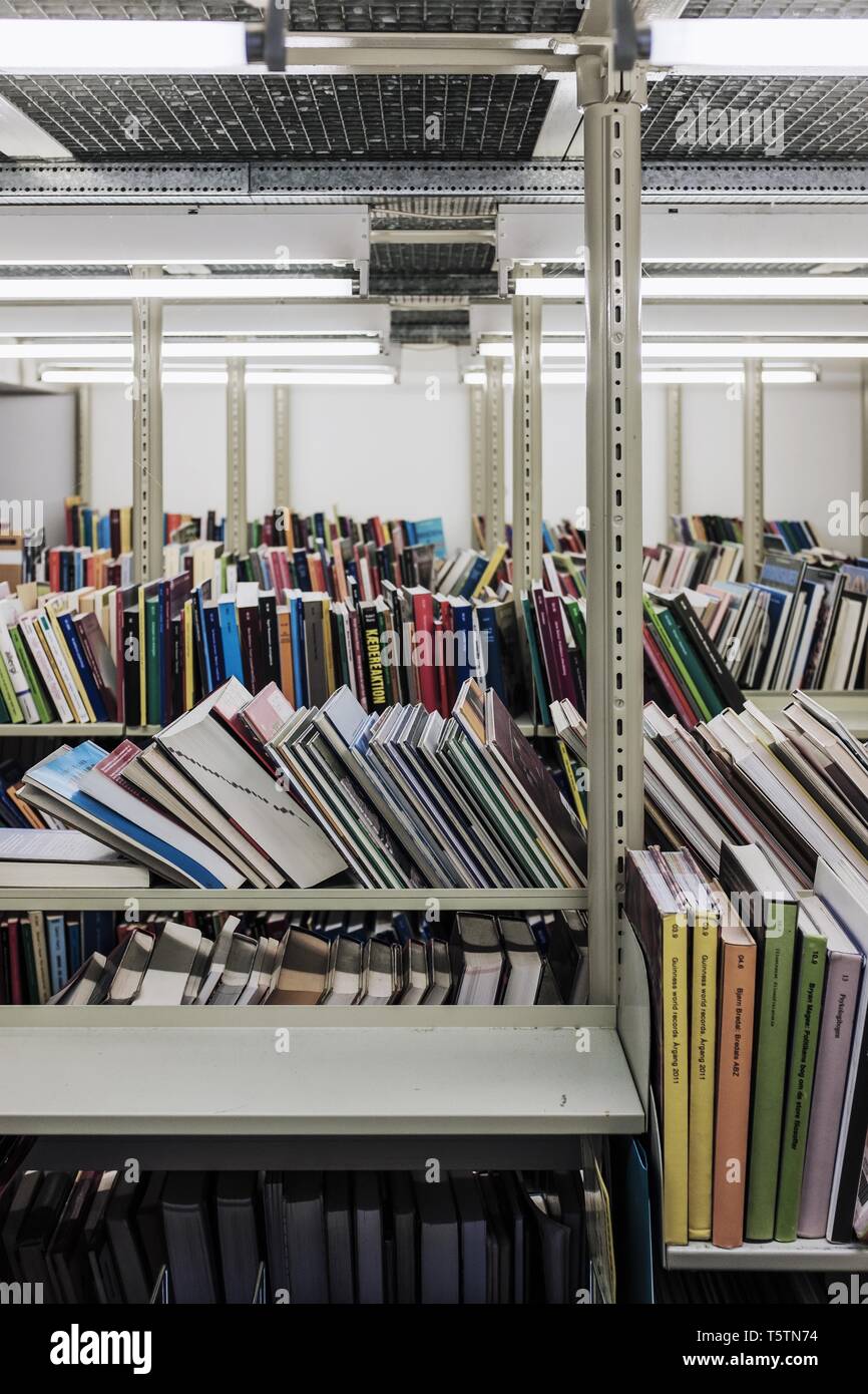 Bookshelves in a row in a book storage Stock Photo - Alamy