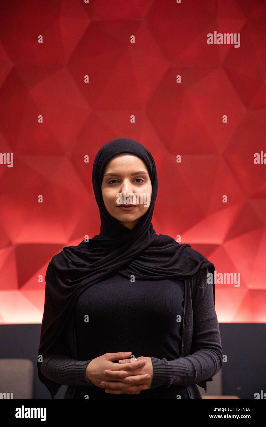 Muslim Girl Standing In A Modern Space With Futuristic
