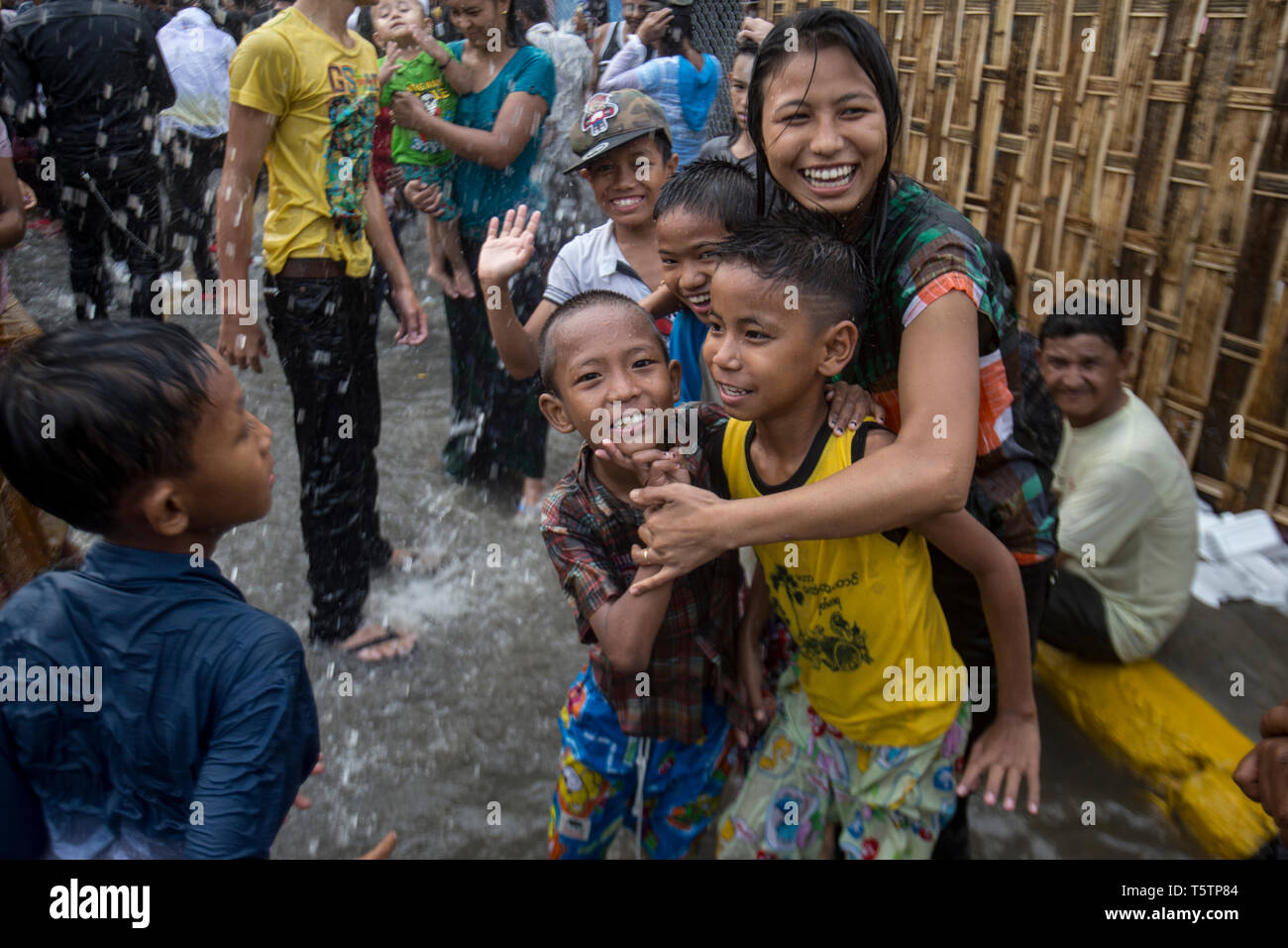 People getting wet and having fun during the Thingyan Burmese New Year Festival in Mandalay, Myanmar. Stock Photo
