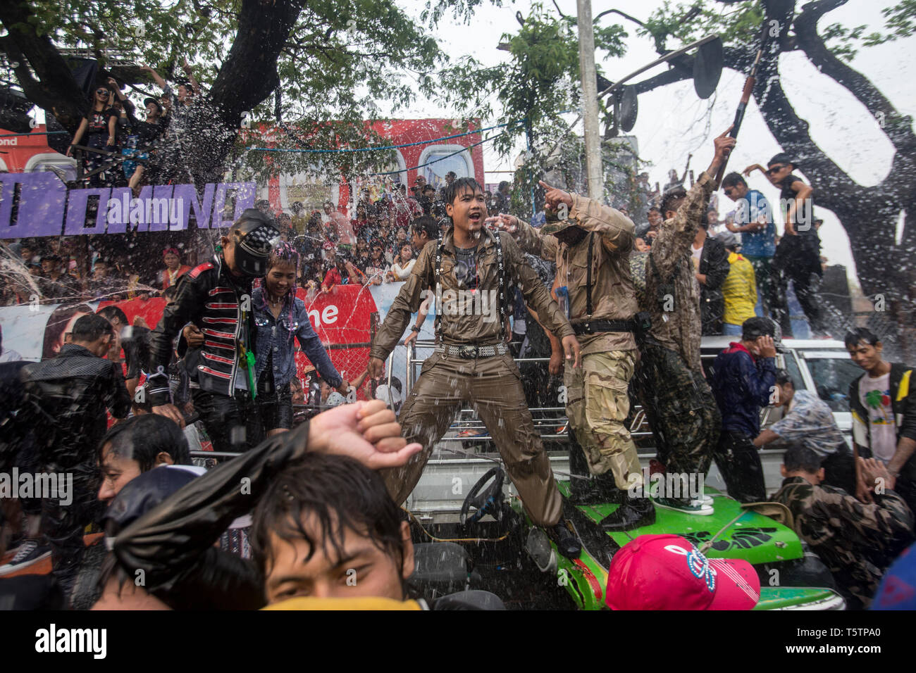 Crowd of people getting wet and having fun in the Thingyan Burmese New Year Festival in Mandalay, Myanmar. Stock Photo