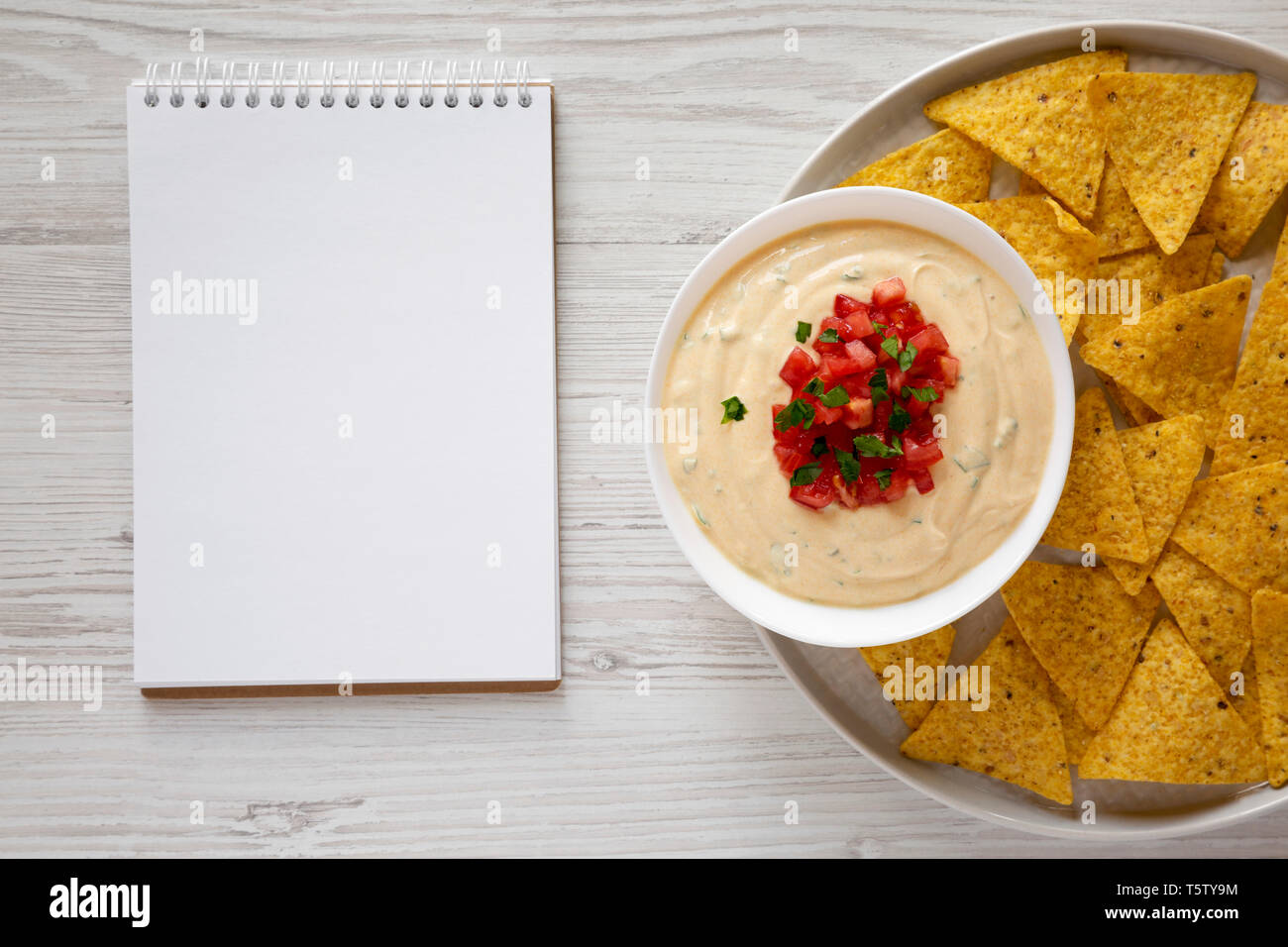 Homemade Cheesy Dip, Yellow Tortilla Chips With Blank Notepad Over ...