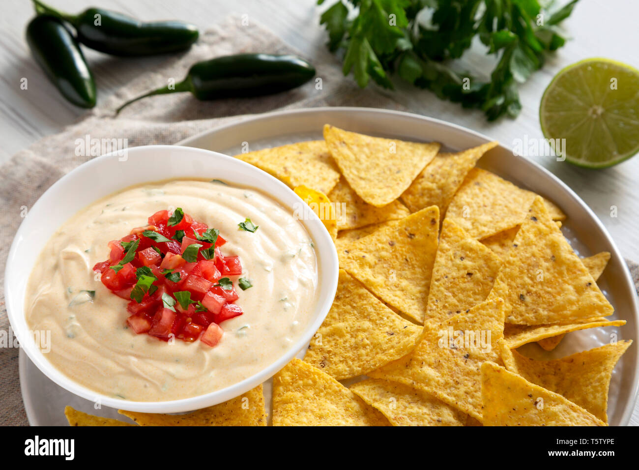 Homemade Cheesy Dip In A Bowl, Yellow Tortilla Chips Over White Wooden ...