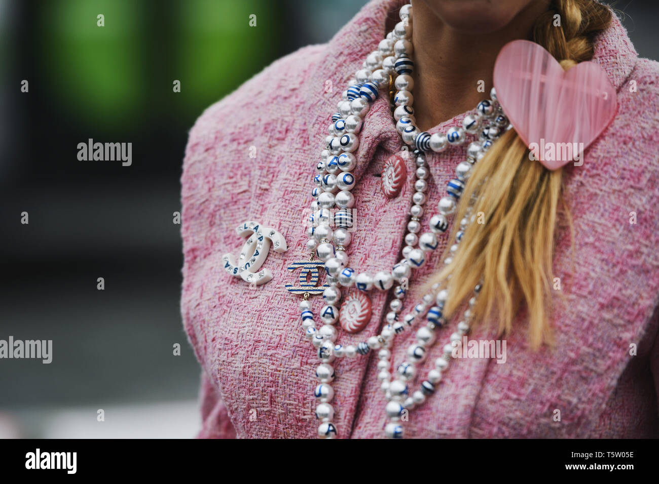 Paris, France - March 5, 2019: Street style - Woman wearing Chanel outfit before a fashion show during Paris Fashion Week - PFWFW19 Stock Photo