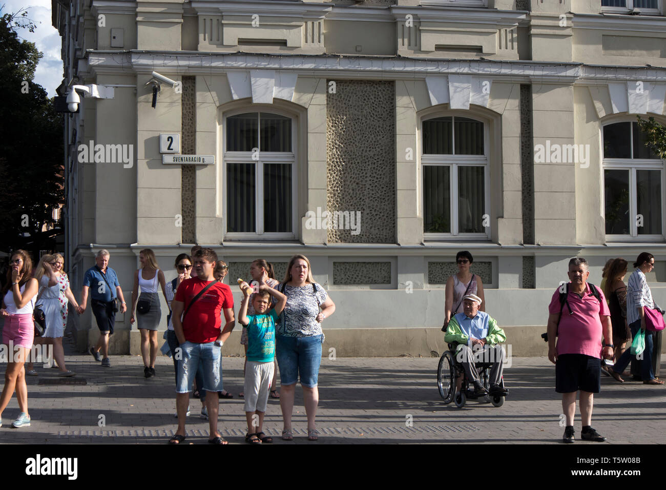 Vilnius, Lithuania - April 16, 2019 , People at a pedestrian crossing waiting for a green light Stock Photo