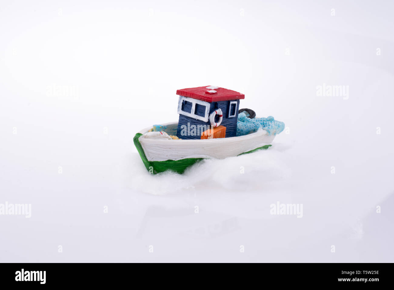 Small Ship model on a white background Stock Photo - Alamy