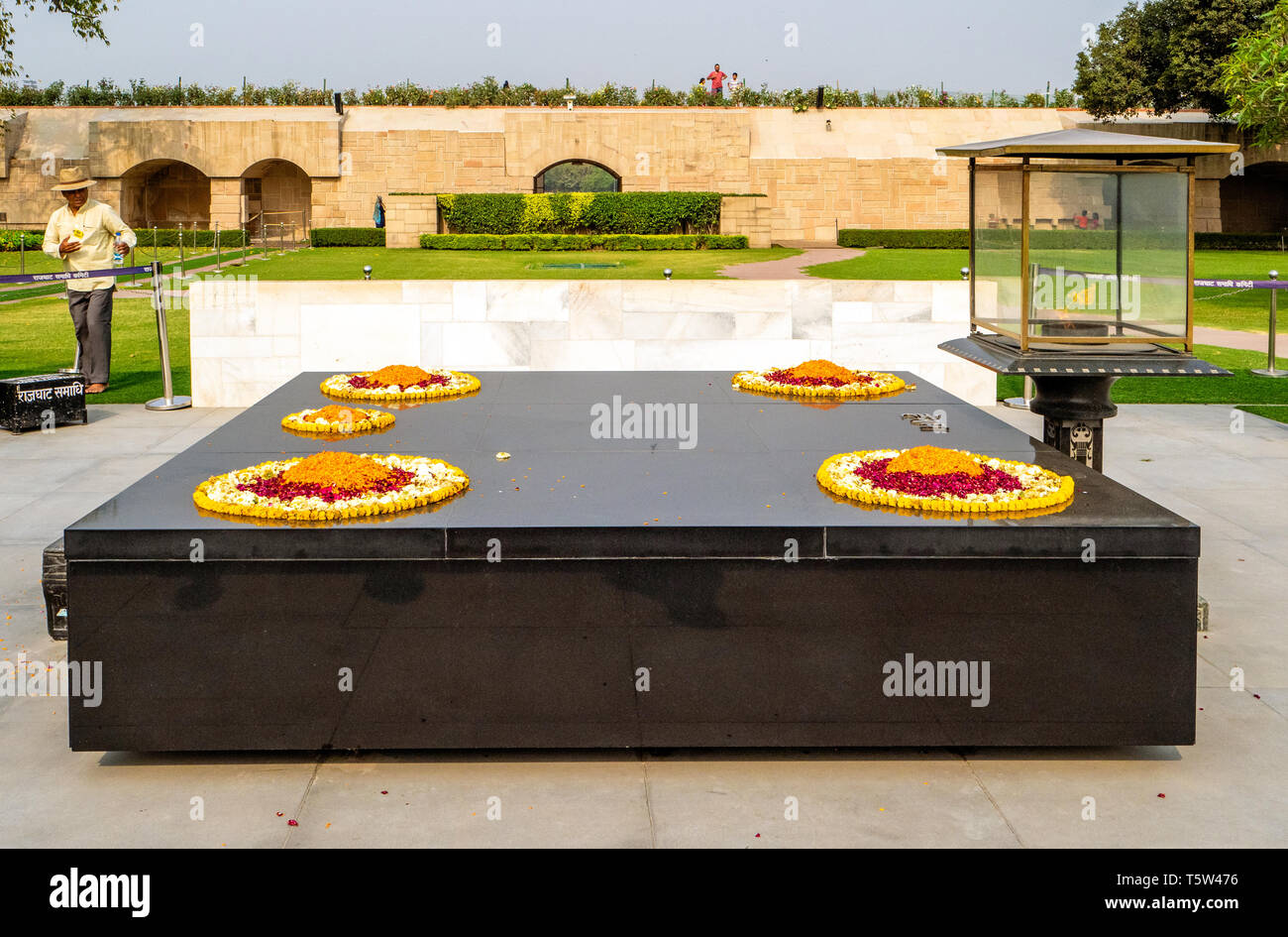 Eternal flame and simple black marble slab at Raj Ghat Mahatma Ghandi's memorial garden in New Delhi northern India Stock Photo