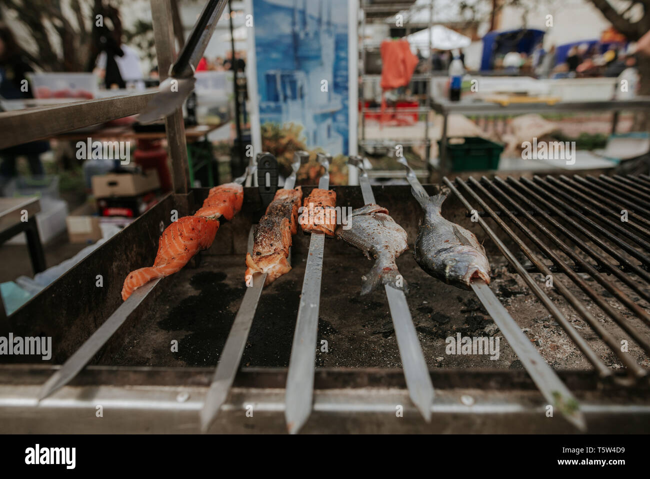 Street food. Cooking mollusks and meat on the street Stock Photo Alamy
