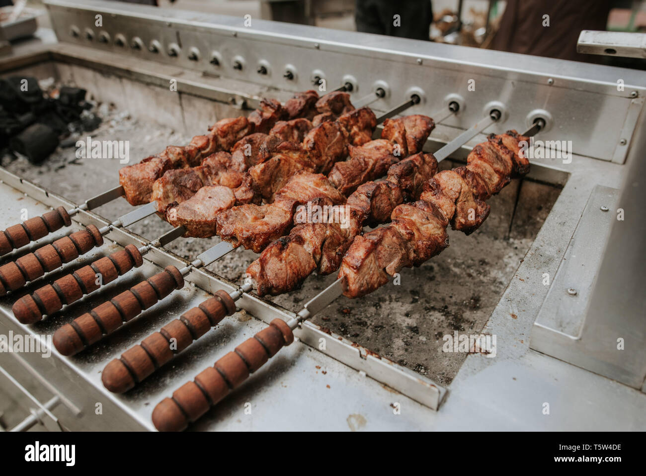 Street food. Cooking mollusks and meat on the street Stock Photo Alamy