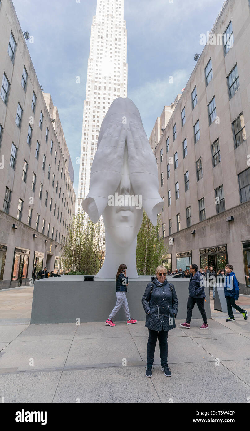 New York, United States. 25th Apr, 2019. Jaume Plensa sculpture Behind the  Walls on display during inaugural exhibition Frieze Sculpture at  Rockefeller Center Credit: Lev Radin/Pacific Press/Alamy Live News Stock  Photo -