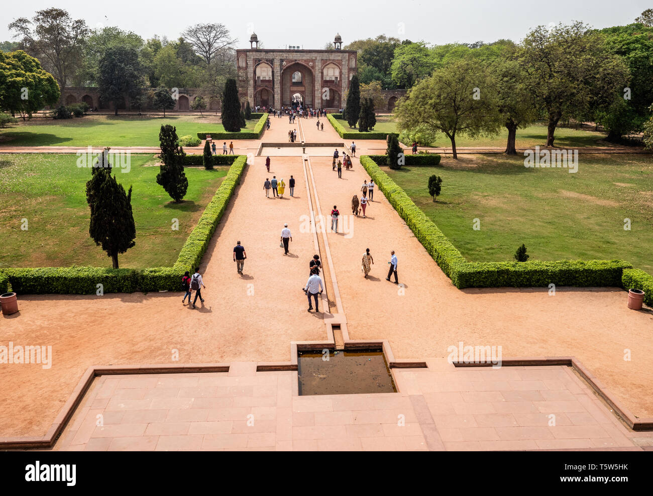 View from Humayuns Tomb along the grand approach and water gardens  to the gatehouse - New Delhi India Stock Photo