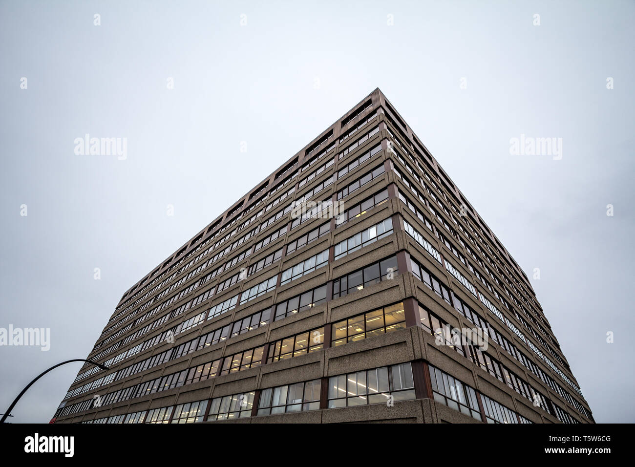 Facade of an old concrete industrial warehouse, office and factory