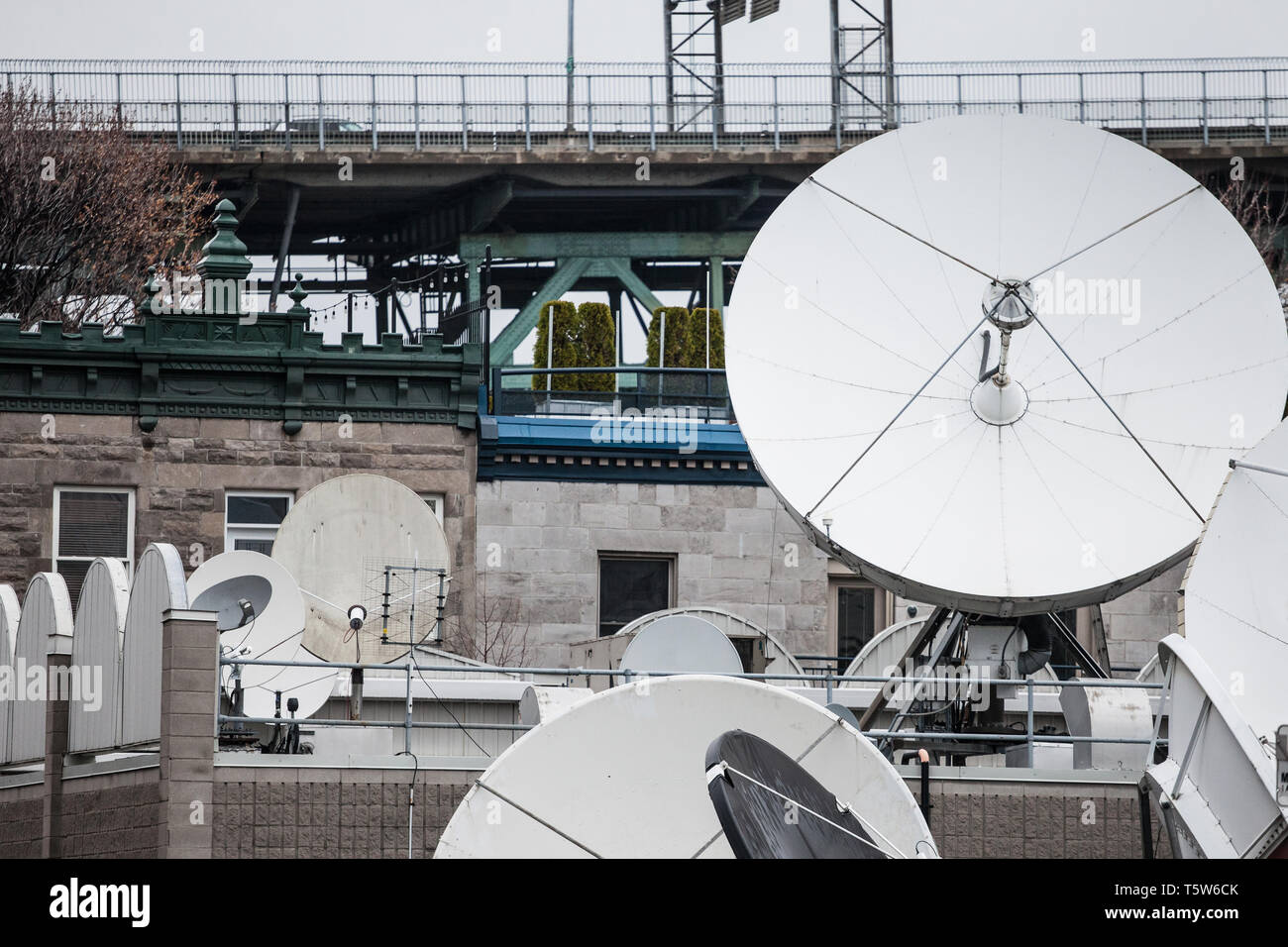 Various satellite dishes and emitters in the technical hub of a media television and radio broadcaster in the suburbs of Montreal, Quebec, Canada  Pic Stock Photo