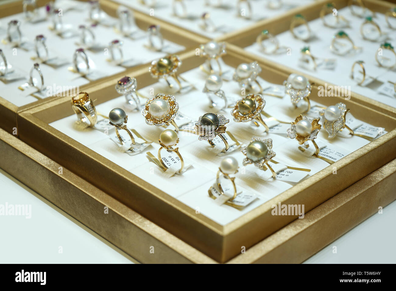 jewelry ball on the golden ring in the display mirror box at jewelry