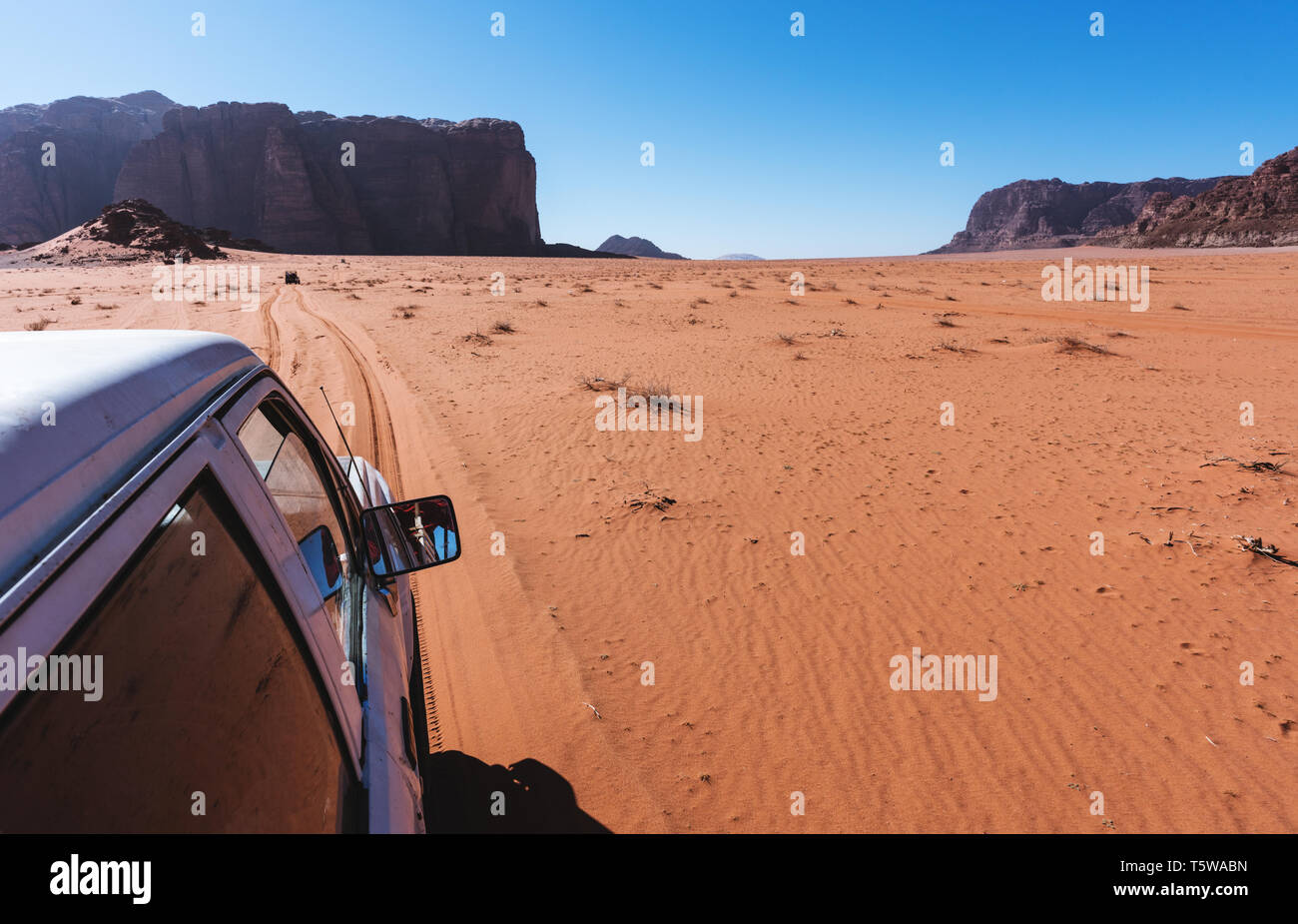 Driving in Wadi Rum desert in Jordan, middle east. Off road car driving on sand in desert Stock Photo