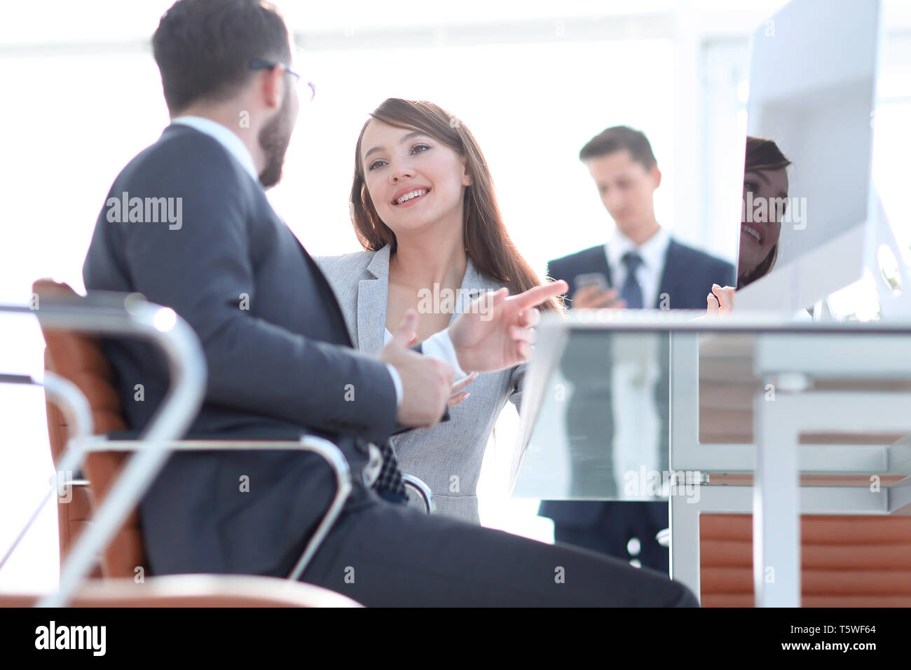business colleagues talking in the office . photo with copy space Stock ...