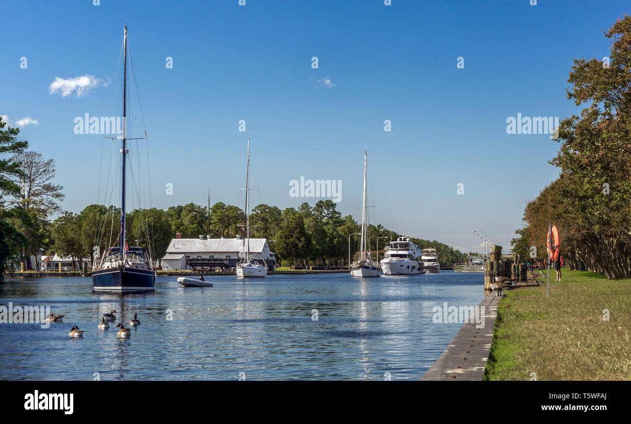 Boats exiting the Great Bridge Locks. Located in Chesapeake Virginia on