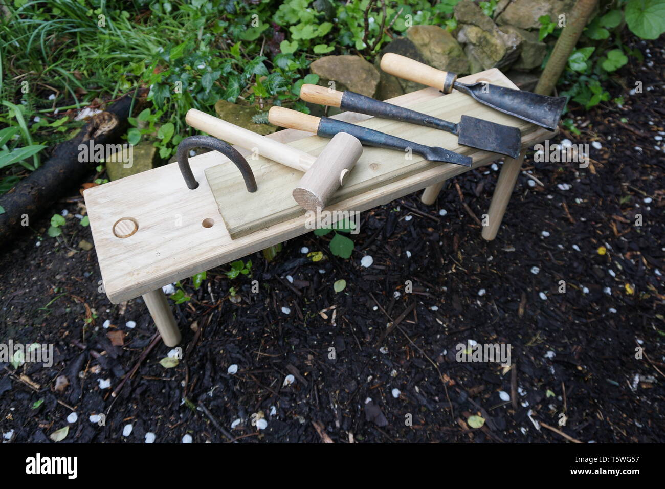Roman Woodworking Chisels And Mallet On A Workbench With A