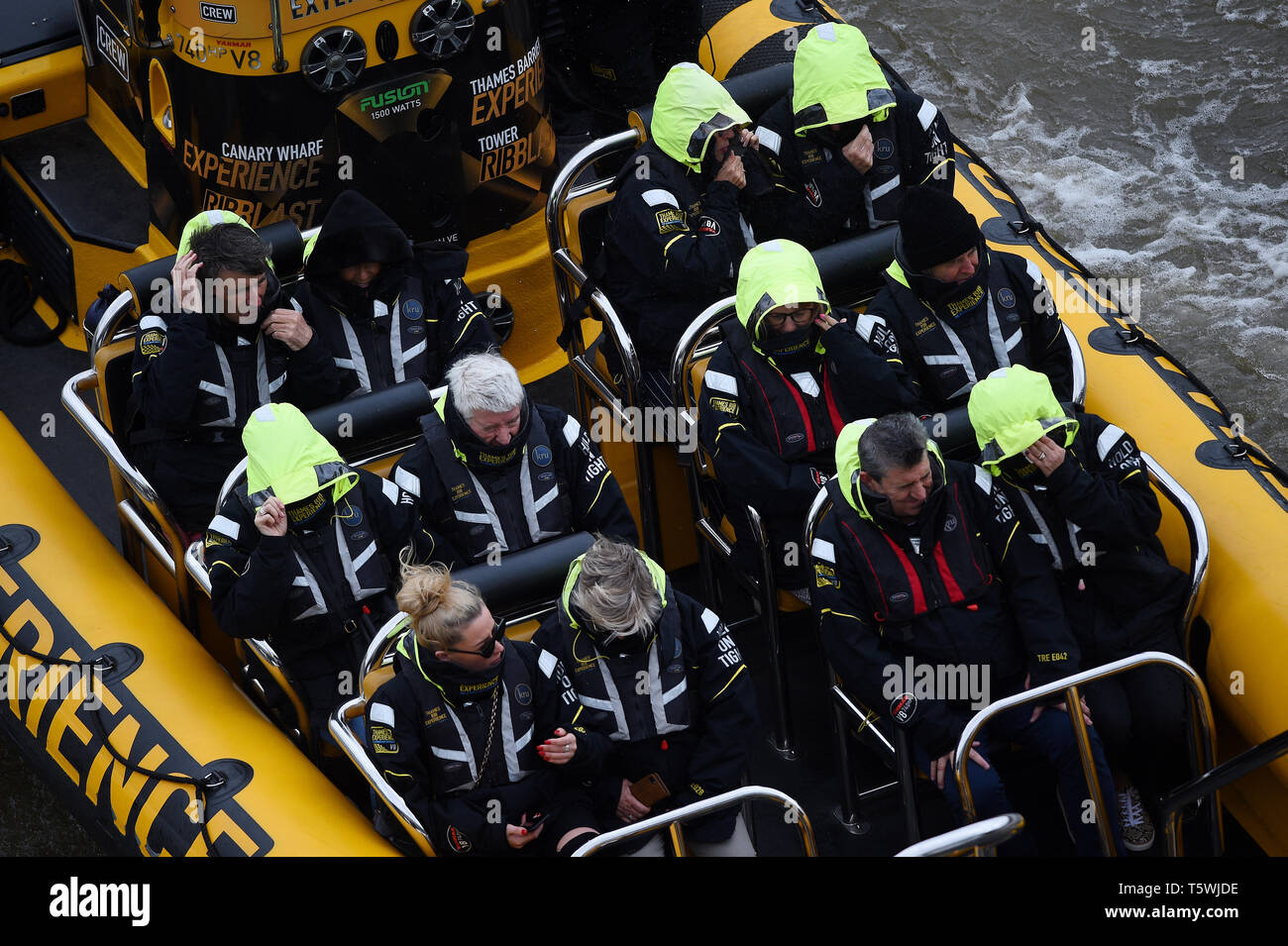 People in a rib boat on the River Thames in London as Storm Hannah gradually blows itself out after battering Wales, Northern Ireland and the west of England with winds of more than 80mph. Stock Photo