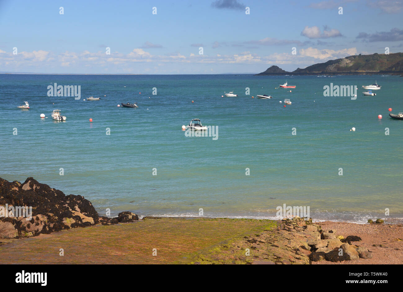 Fishing Boats Anchoured up by the Slipway in Bouley Bay on the Island of Jersey, Channel Isles, UK. Stock Photo