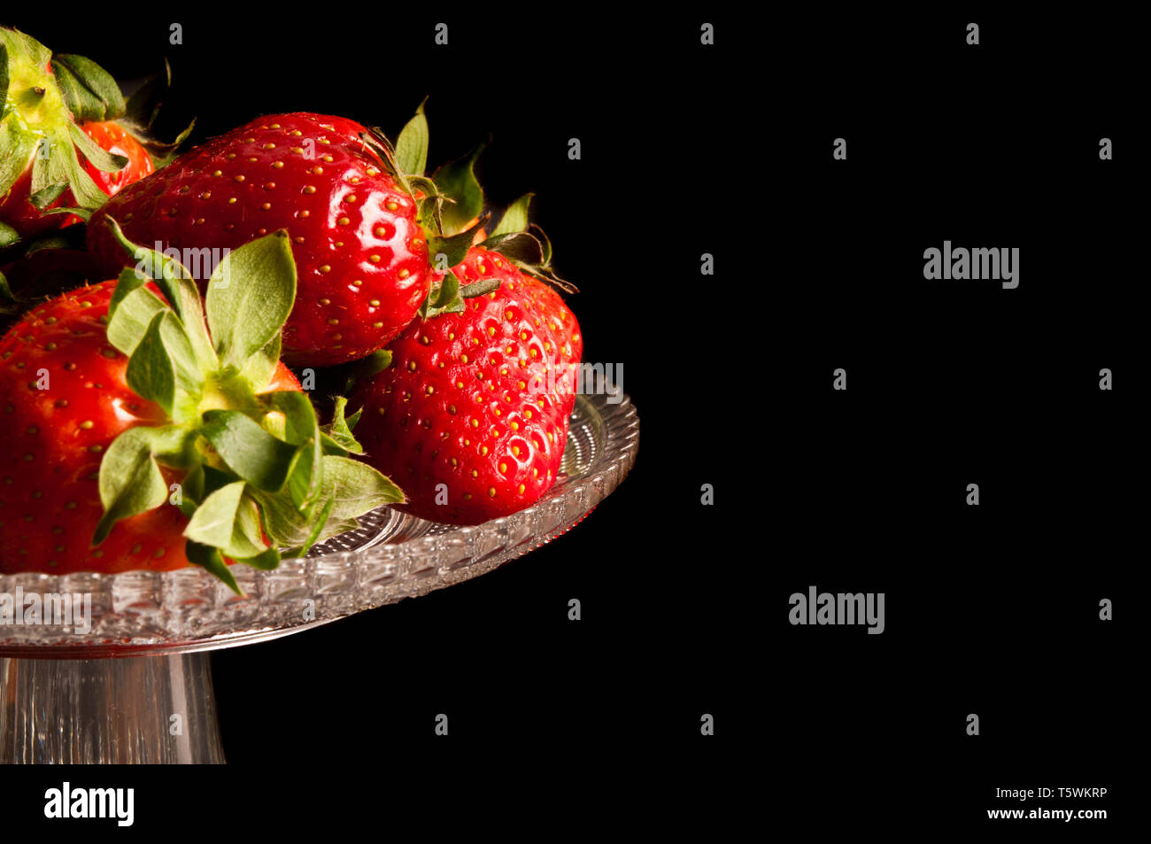 Strawberries in a glass stand hi-res stock photography and images - Alamy