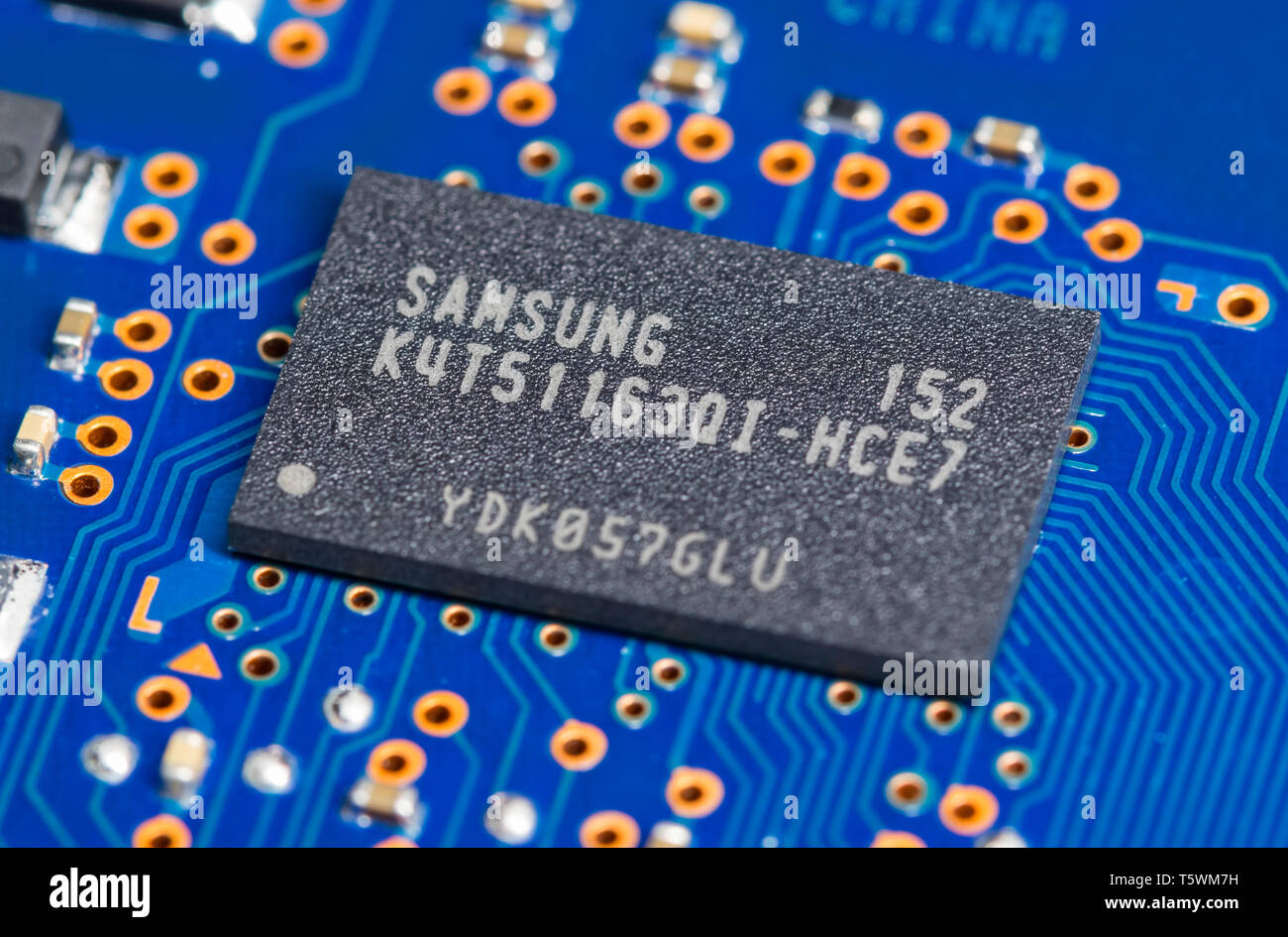 Samsung DDR2 SDRAM memory chip in a FBGA package mounted on a PCB for a hard disk drive. Stock Photo