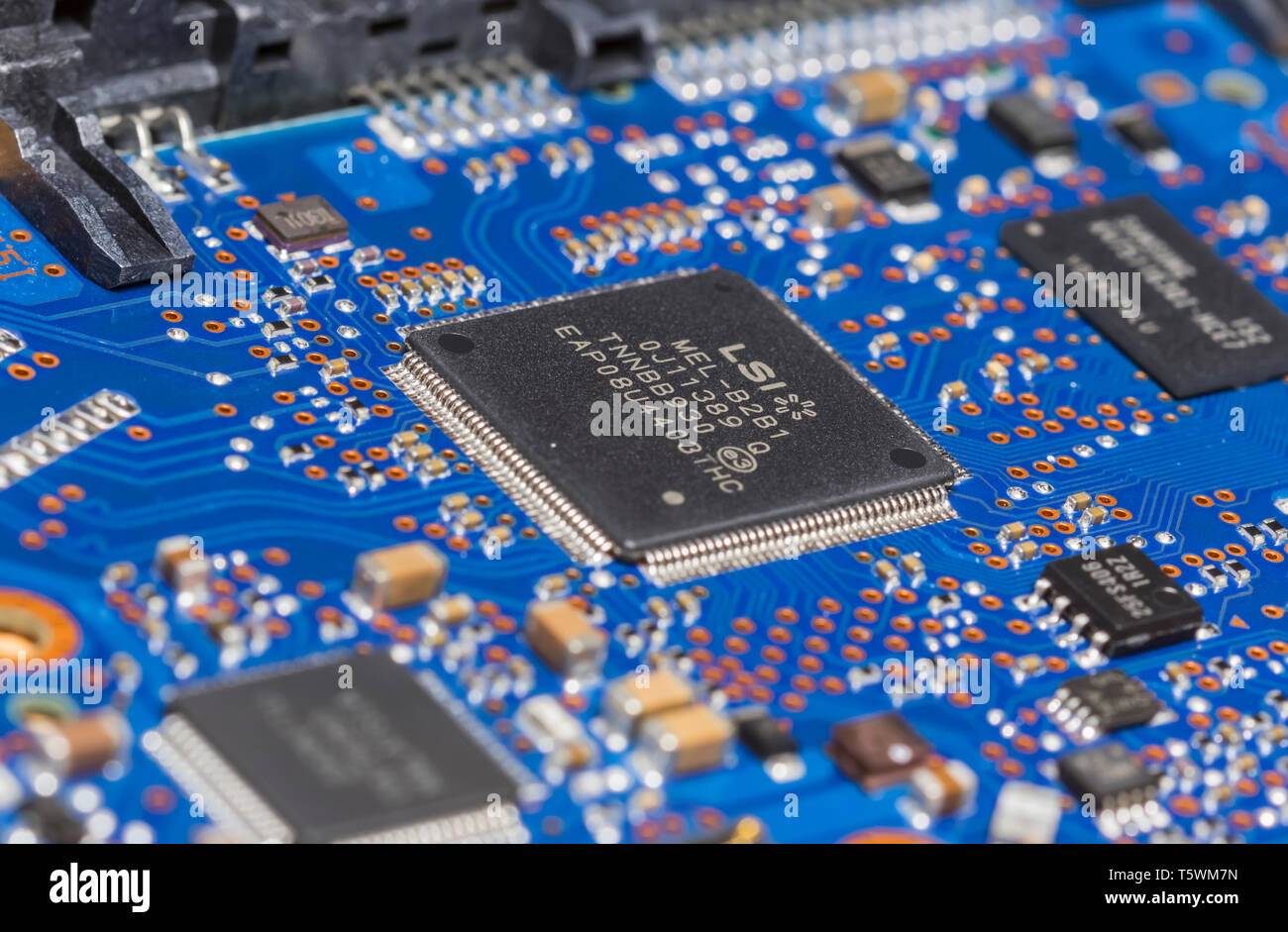 Macro of Integrated circuits and other surface mount (SMT) components mounted on a PCB (Printed Circuit Board). Stock Photo