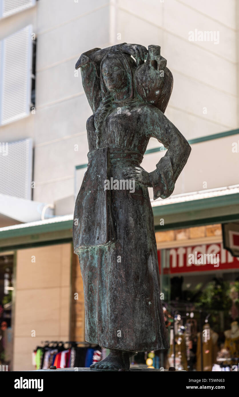 Darwin Australia - February 22, 2019: Closeup of The bronze Water Bearer statue on the mall downtown, created by sculptor Irene Kokkinos. Commercial s Stock Photo