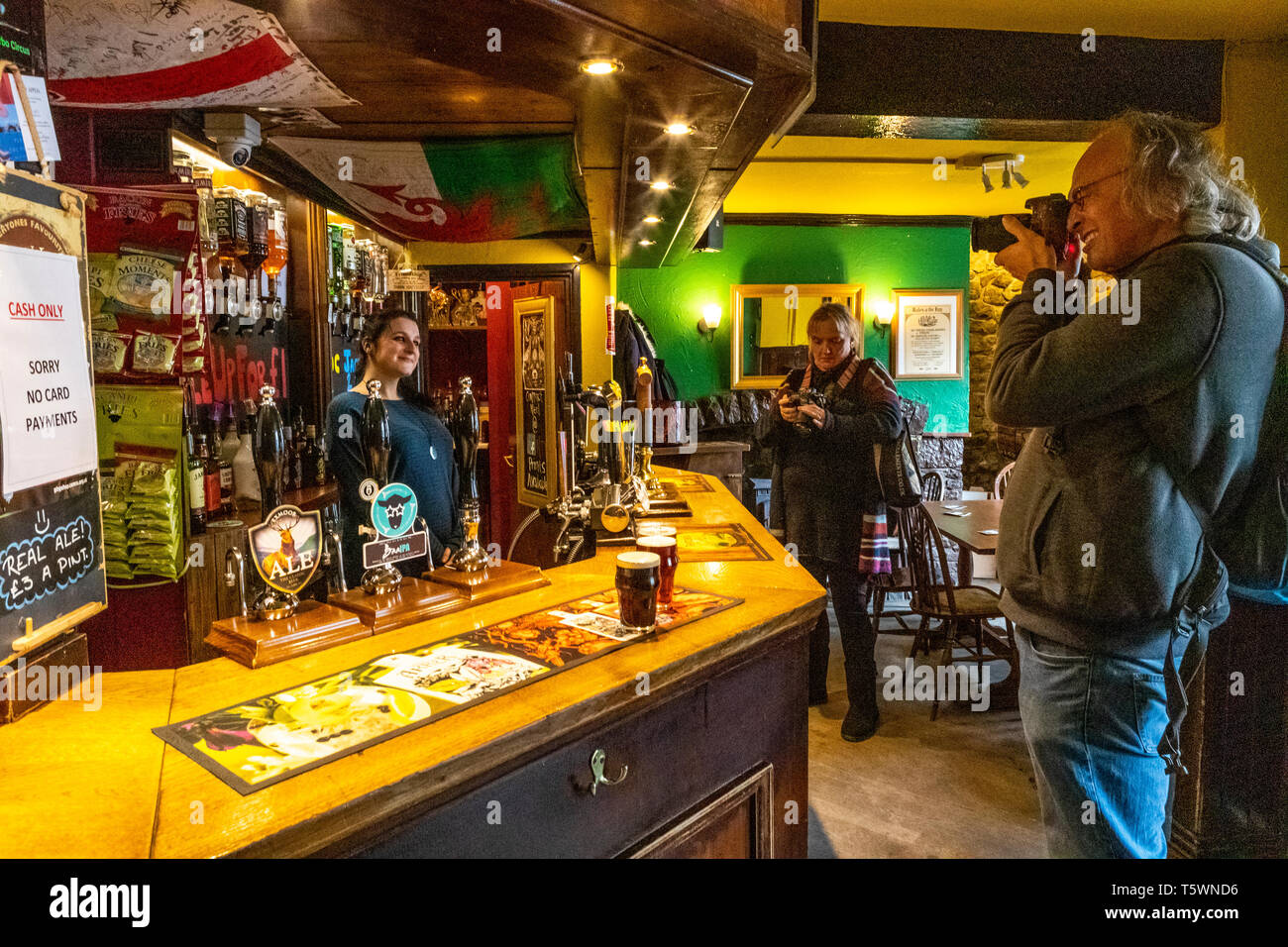 A barmaid at The Five Alls pub poses for photographers. Chepstow street ...