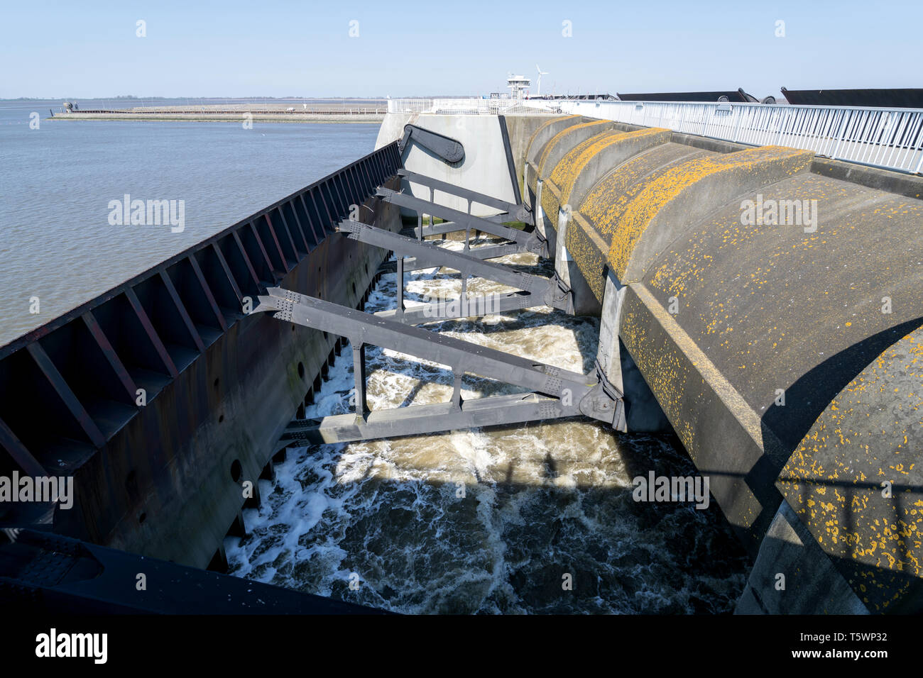 Eidersperrwerk (Eider Barrage) at the mouth of the river Eider on Germany’s North Sea coast. It is Germany’s largest coastal protection structure. Stock Photo