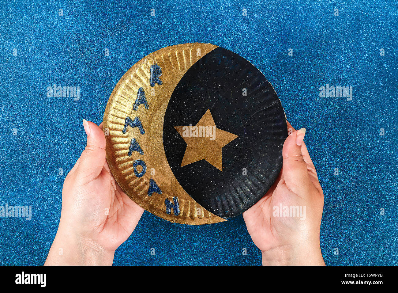 https://c8.alamy.com/comp/T5WPYB/17-diy-ramadan-kareem-crescent-moon-with-a-star-from-a-disposable-cardboard-plate-and-gold-paint-gift-idea-decor-ramadan-kareem-step-by-step-top-v-T5WPYB.jpg