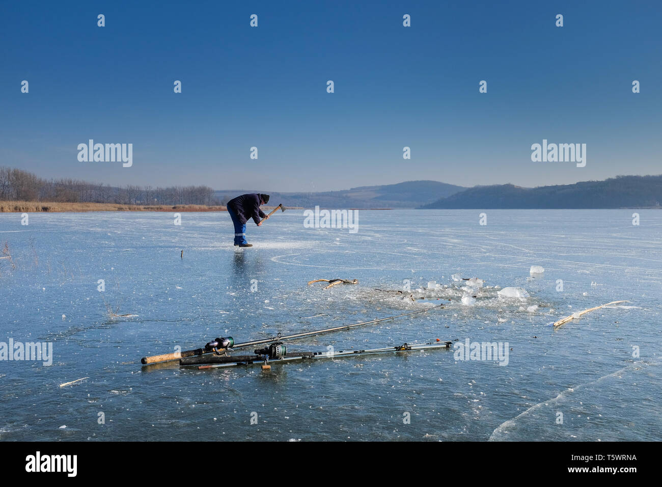 Fishermen on the ice of the Rakaca Water reserve near Rakaca, Hungary Stock  Photo - Alamy