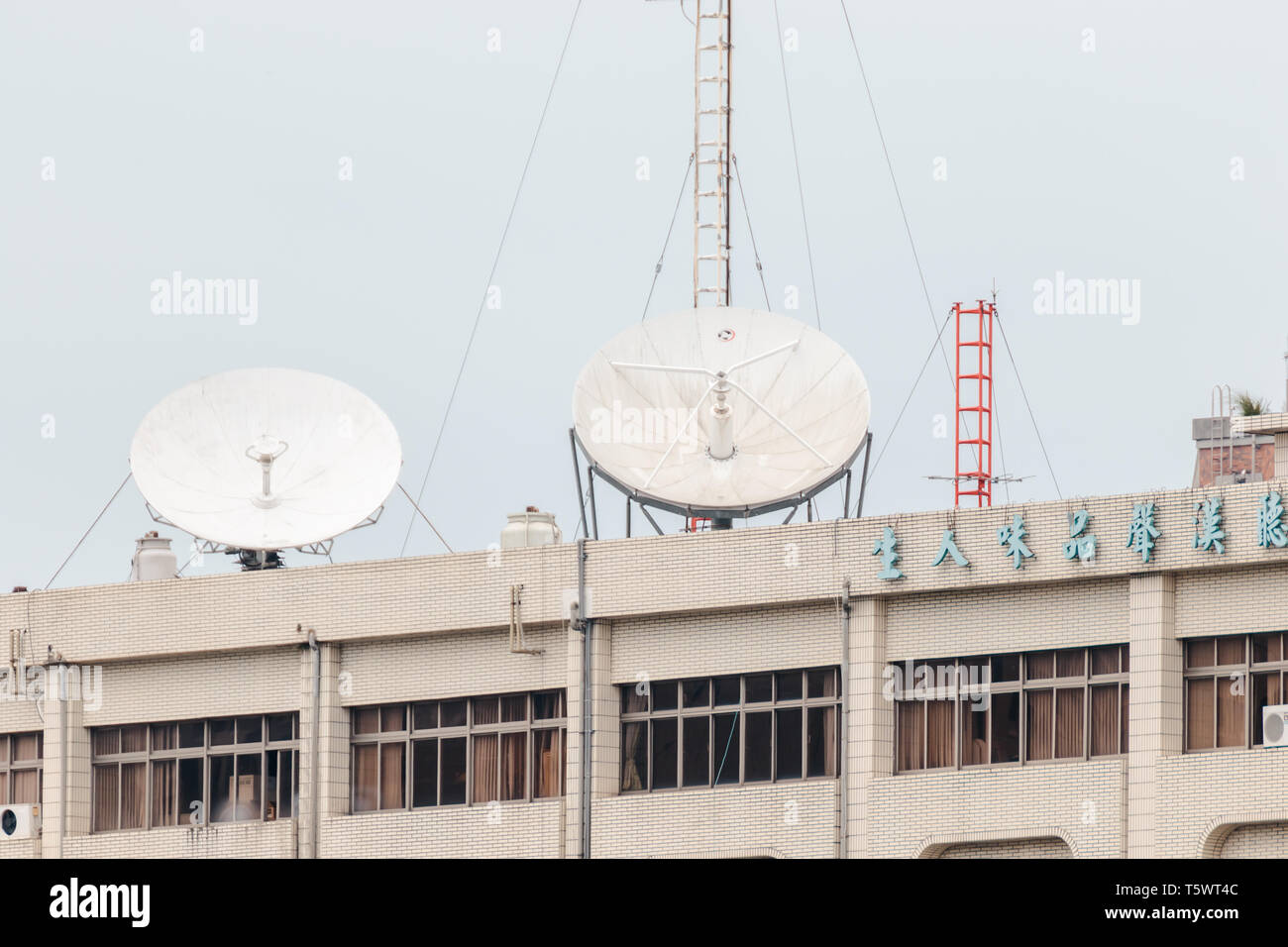 Huge satellite dish installed on the top of flat apartment to pick up