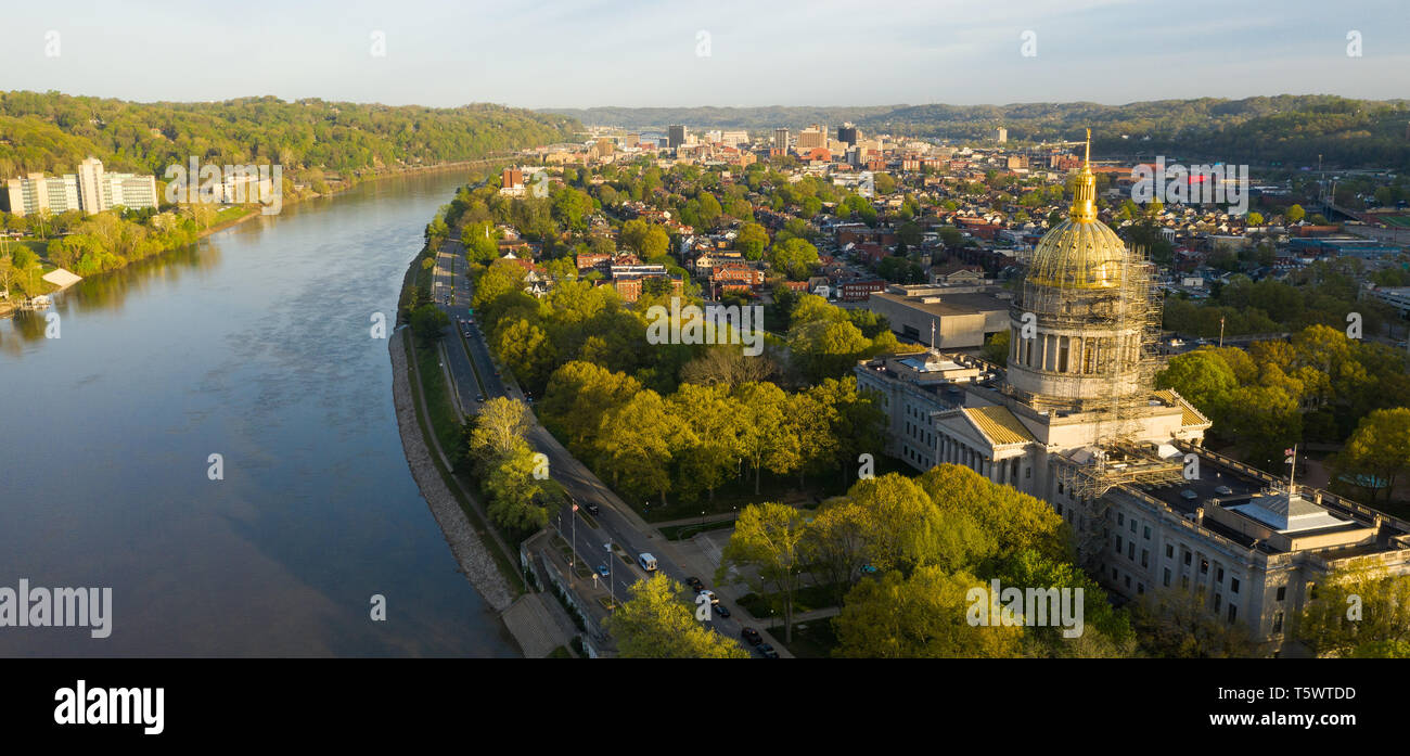 Sunrise reflects in the Kanawha River slowly flowing by picturesque