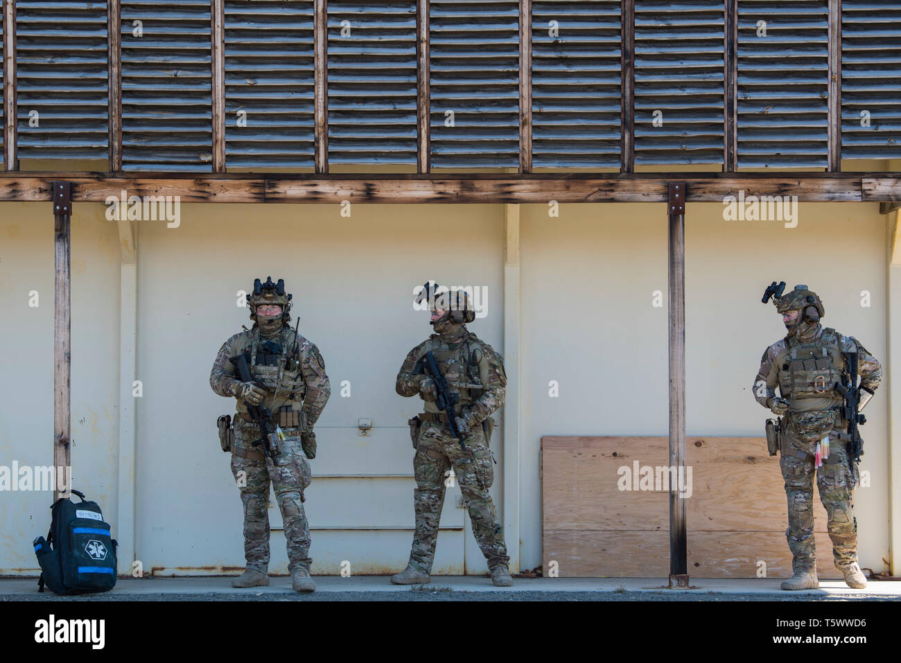 U.S. Coast Guardsmen with Maritime Security Response Team-West survey the area following a live-fire close-quarters combat demonstration at Joint Base Elmendorf-Richardson, Alaska, April 15, 2019. The MSRT-W is a Coast Guard tactical unit that specializes in maritime counter terrorism and high-risk law enforcement. While at JBER, the team participated in a capabilities and limitations briefing, equipment display and live-fire close-quarters combat demonstration. (U.S. Air Force photo by Airman 1st Class Caitlin Russell) Stock Photo