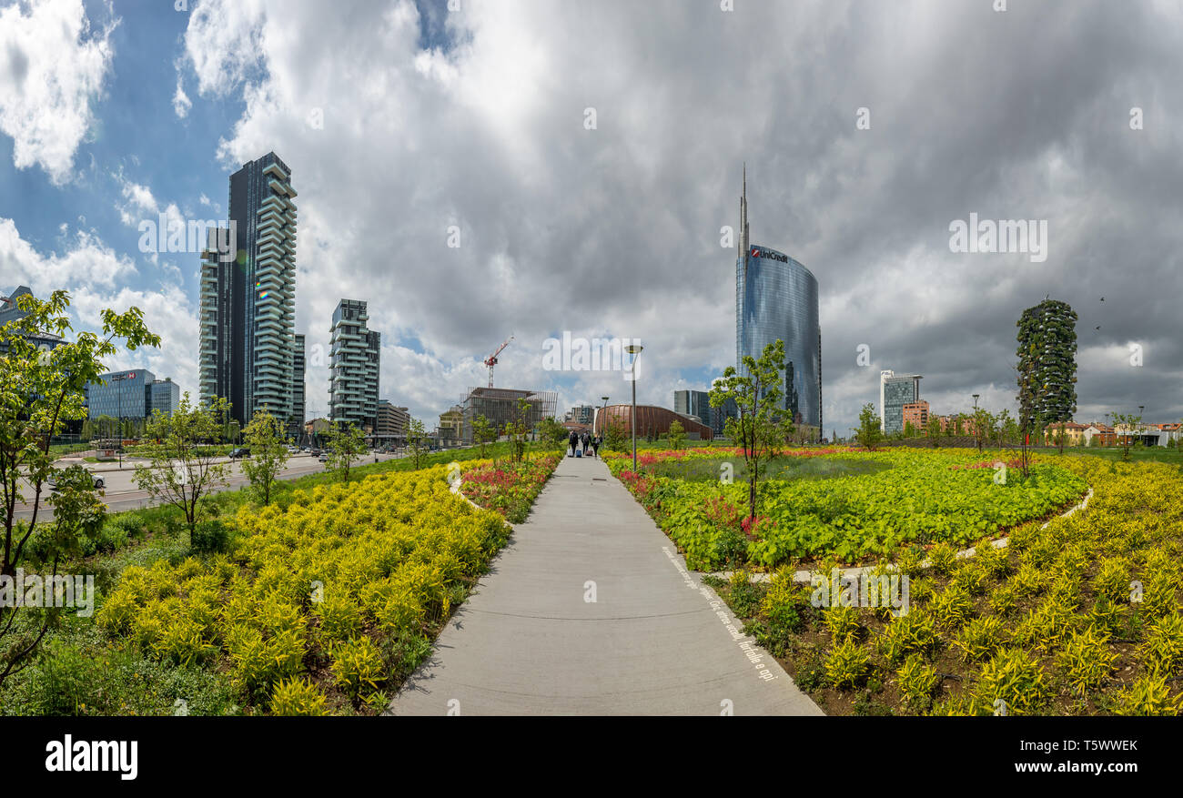 The recently opened park 'Biblioteca degli alberi' in Milano. In the background the Unicredit and Bosco Verticale skyscrapers. Italy Stock Photo