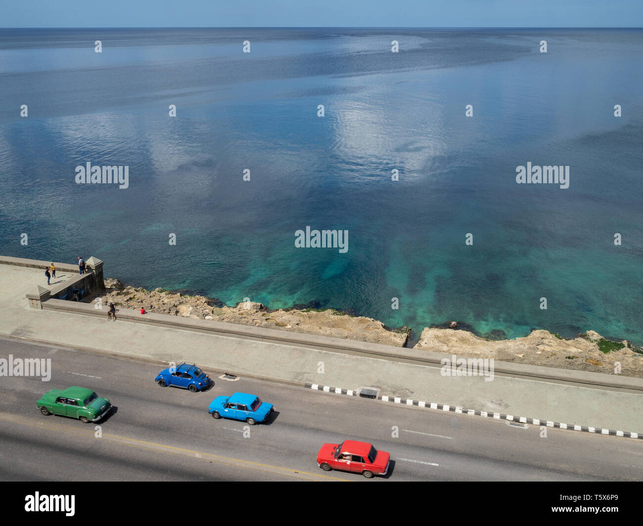 Classic cars driving down the Malcon in Havana, Cuba, aerial view Stock Photo