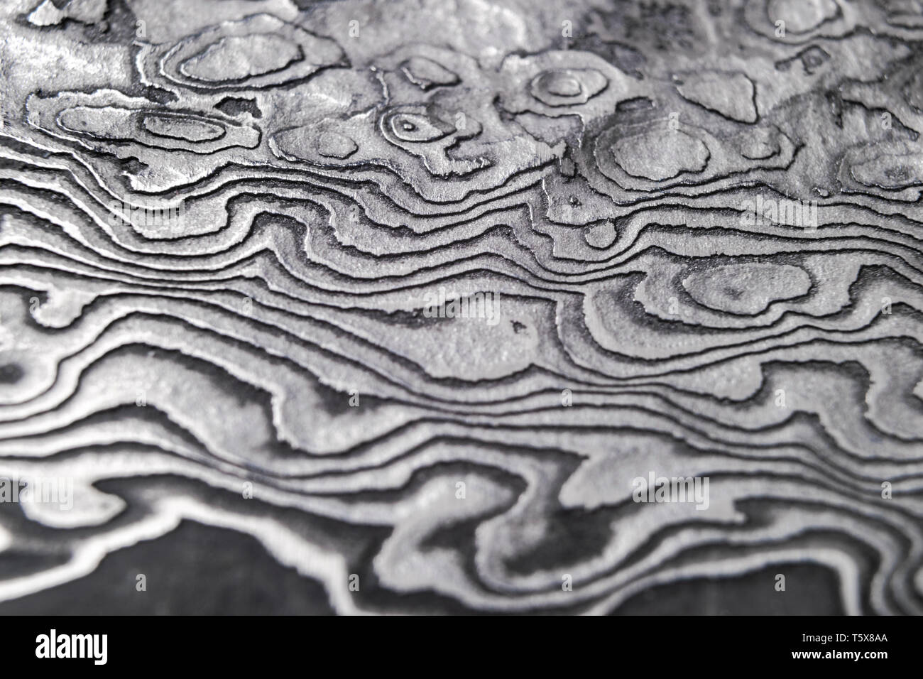 Background with pattern of damask steel. Close up. Macro shot of a damascus knife  blade texture. Damascus steel pattern. Metal and steel background. D Stock  Photo - Alamy