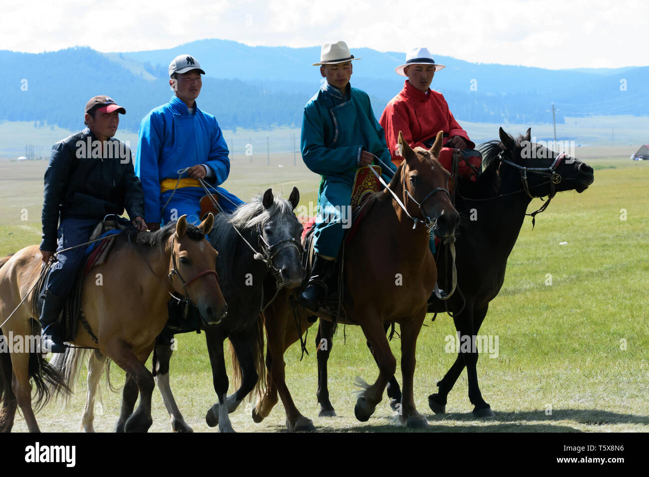 Naadam Festival in Khatgal, Mongolia. Young horseriders in their colourful garments Stock Photo