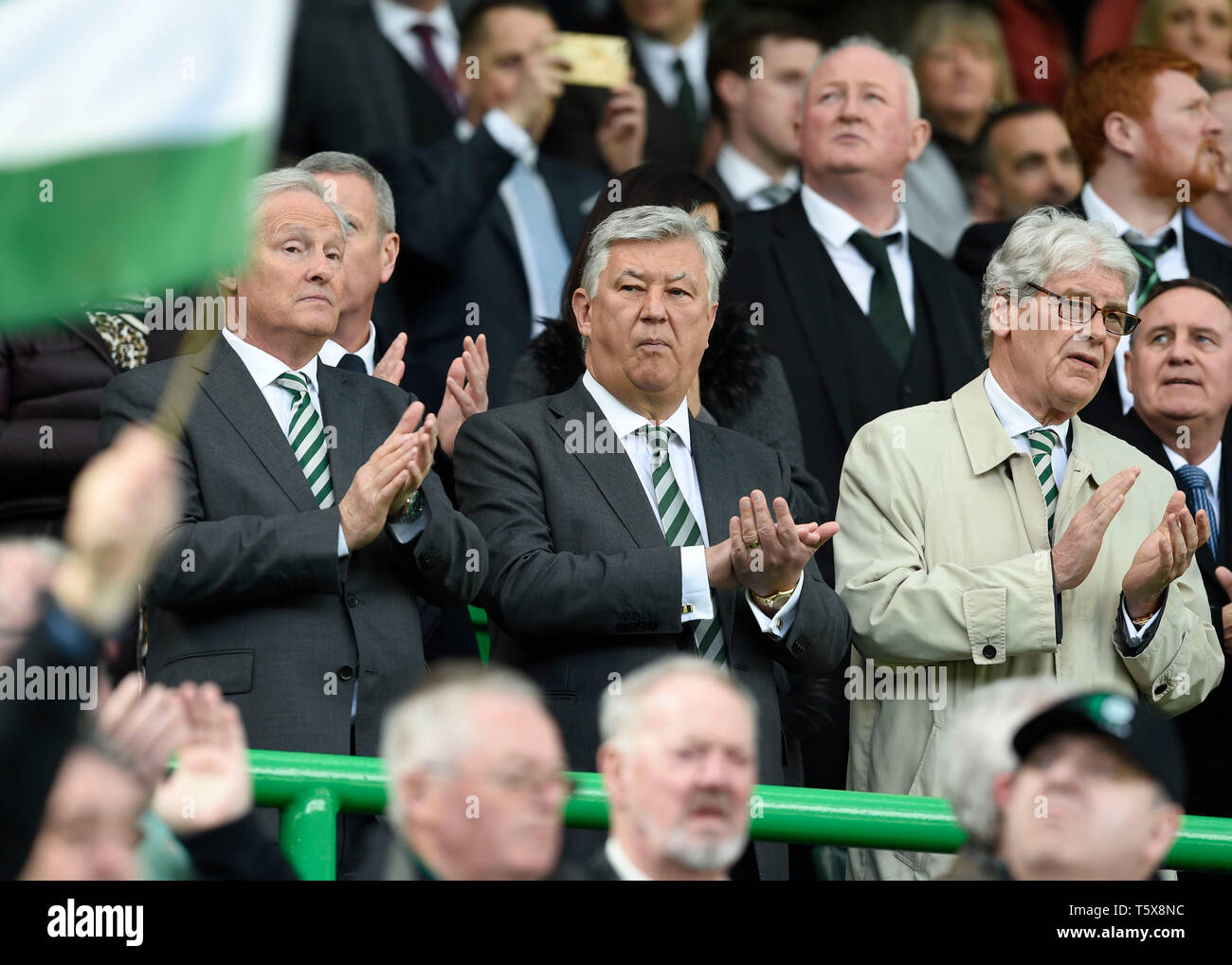 Celtic Chief Executive Peter Lawwell (centre) during the applause for ...