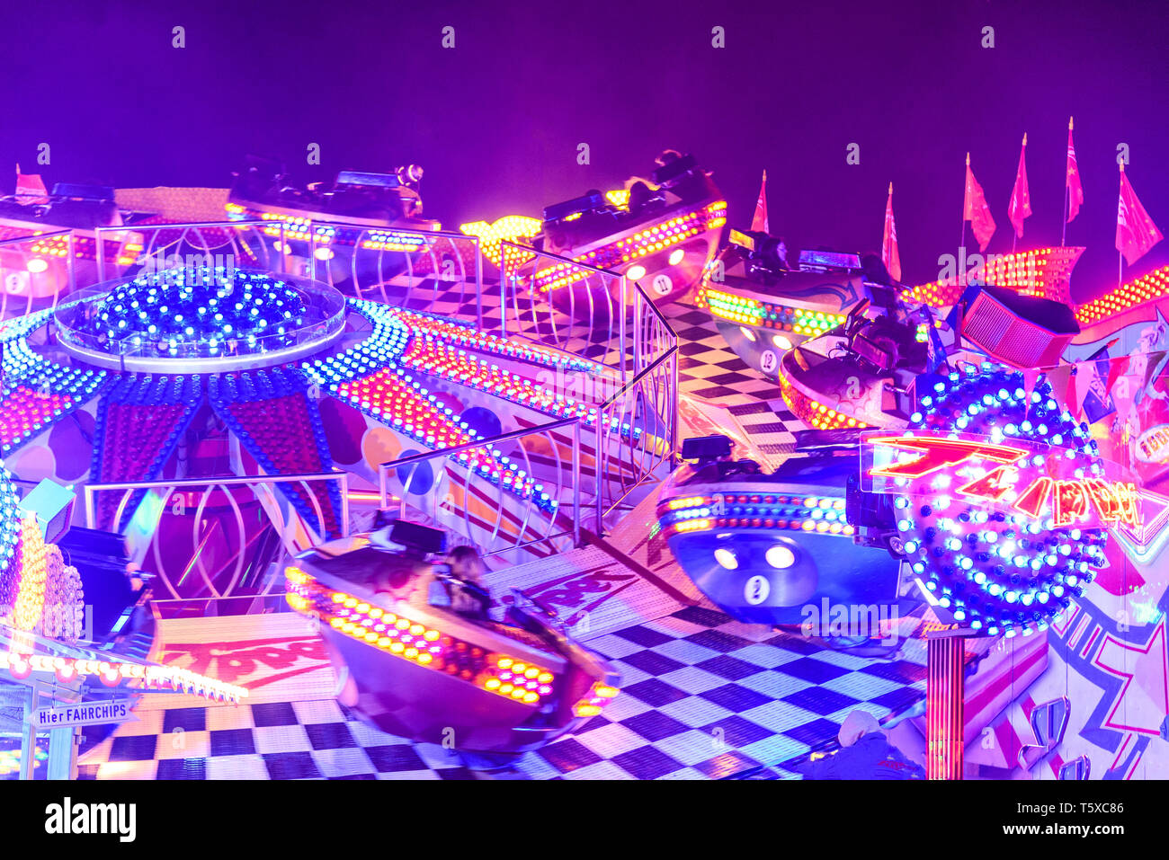 Colorful illuminated fairground attraction Stock Photo Alamy