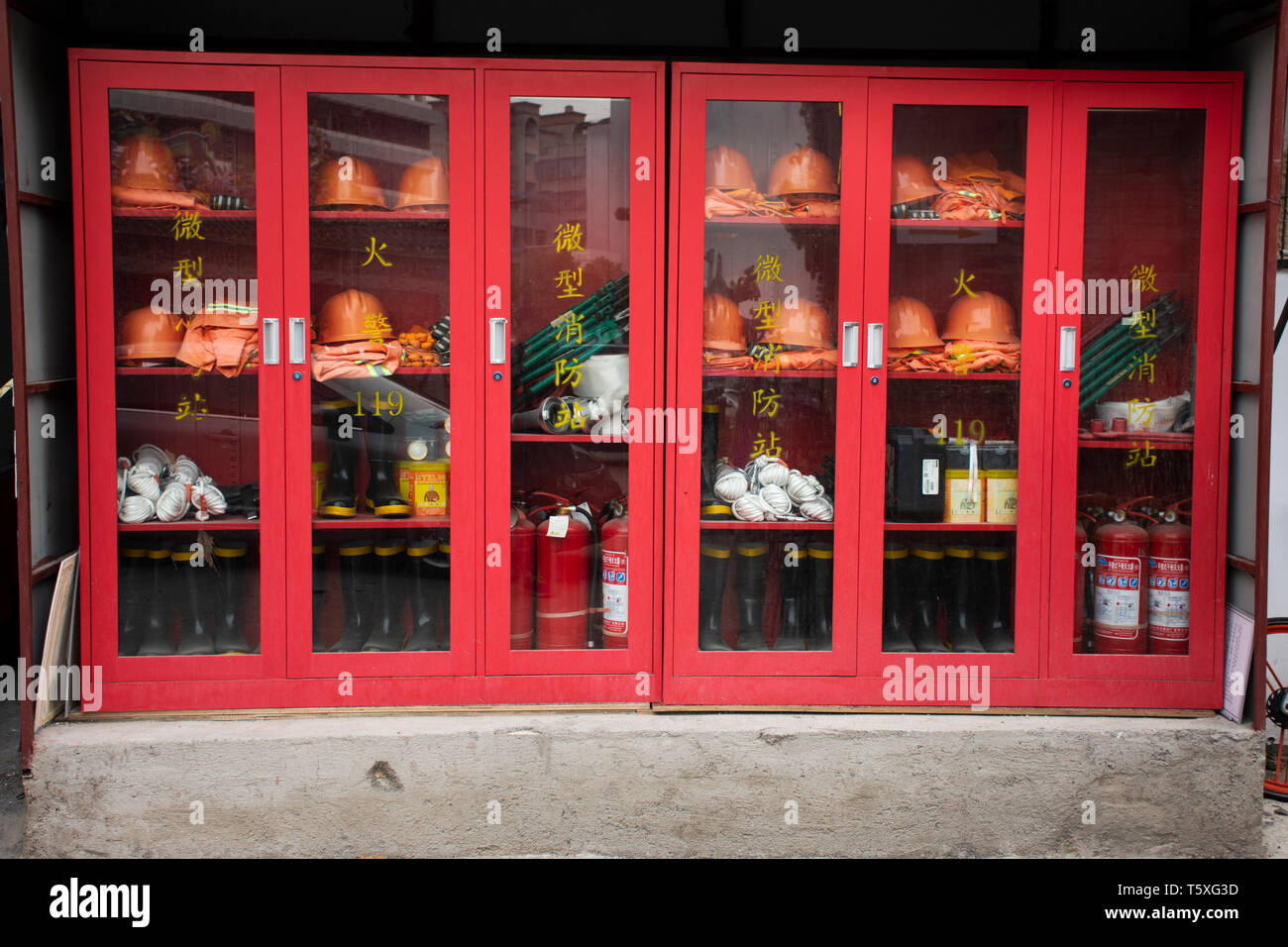 Emergency fire equipment station for firefighter and caution label at old town area at Shantou downtown or Swatow city on May 9, 2018 in Guangdong, Ch Stock Photo