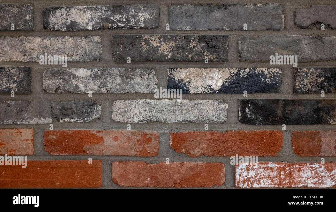 Red brick, black brick, coarse texture. Stock Photo