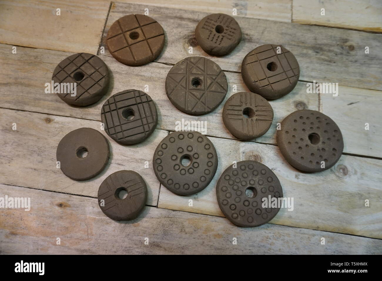 viking pottery spindle whorls in various designs based on the finds ...