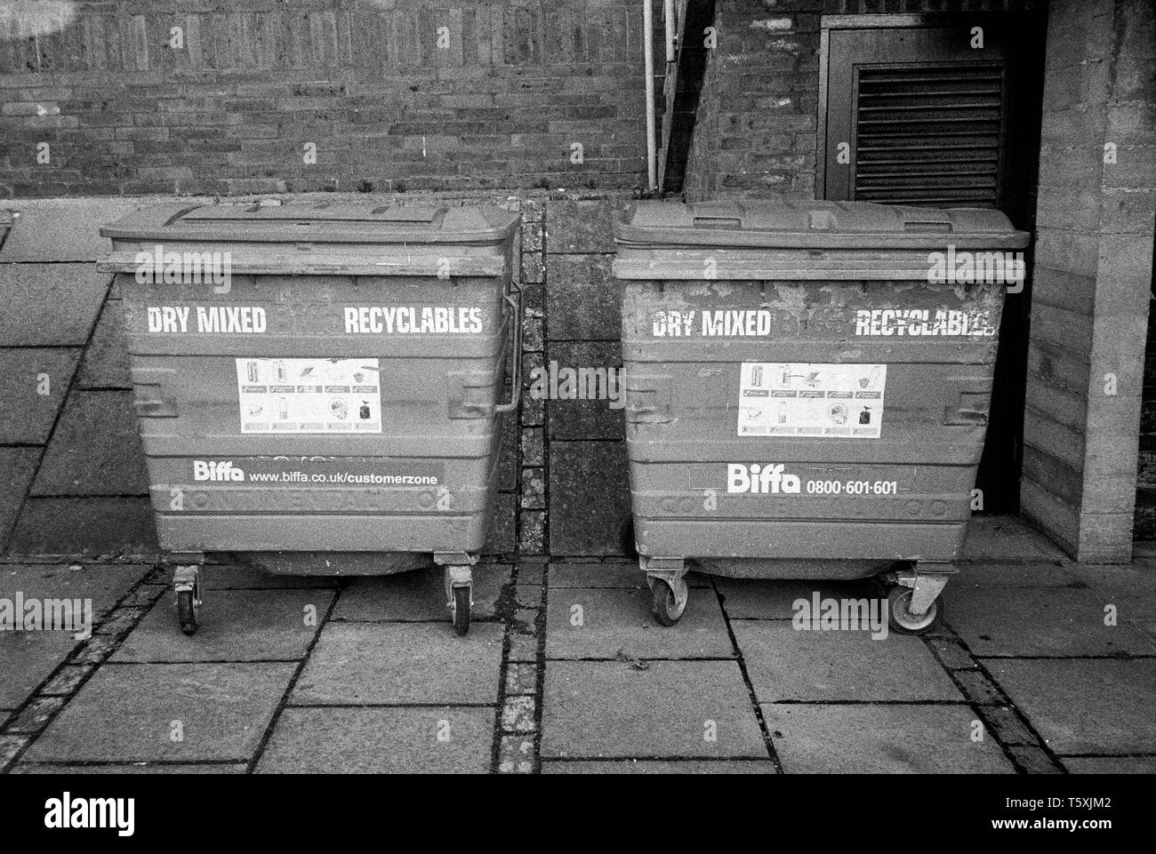 Biffa waste recycling wheelie bins Black and White Stock Photos
